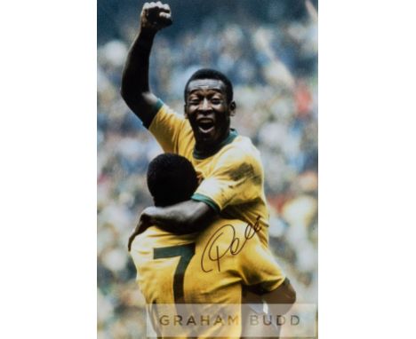 Pele signed colour photographic print celebrating in the Brazil jersey with fist in the air, featuring Pele raised into the a