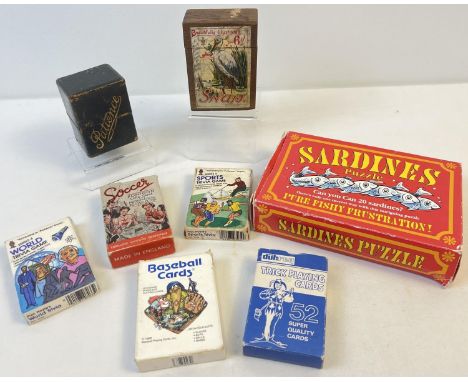 A collection of assorted vintage playing cards, card games and puzzle. To include wooden boxed Snap game, leather boxed Patie