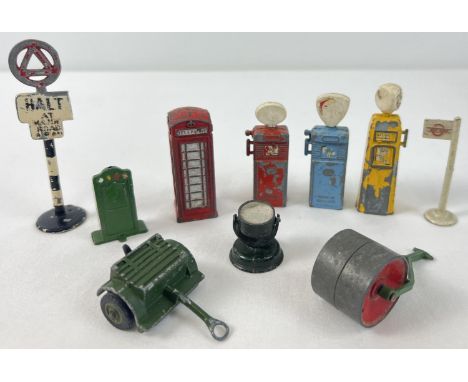 10 vintage diecast vehicle accessories to include petrol pumps, road sign, telephone box, flood light, bus stop and garden ro
