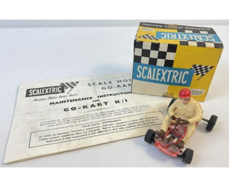 A boxed 1960's Tri-ang Scalextric Electric Model Racing K/1 Go-Kart in red. Together with original maintenance instructions. 