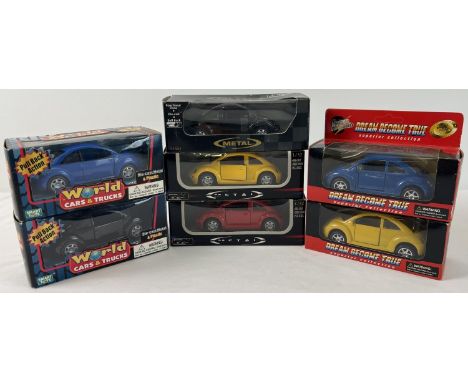 7 assorted boxed 1/32 scale diecast Volkswagen Beetle cars.  All with pull back action and opening doors, in various colours.