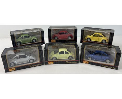 6 boxed 1/43 scale Maisto motorised diecast Volkswagen Beetle cars, in various colours. 