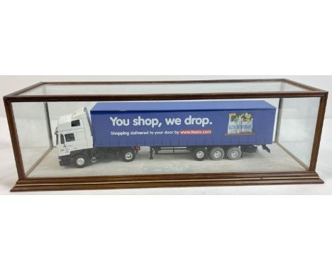 A 1:43 scale diecast Tibbett &amp; Britten Tesco lorry by Eligor in a bespoke made glass display case. Case approx. 14.5 x 47