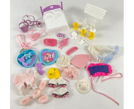 A collection of vintage My Little Pony clothes and accessories. To include reins and saddles, double bed, slumber outfit, rol