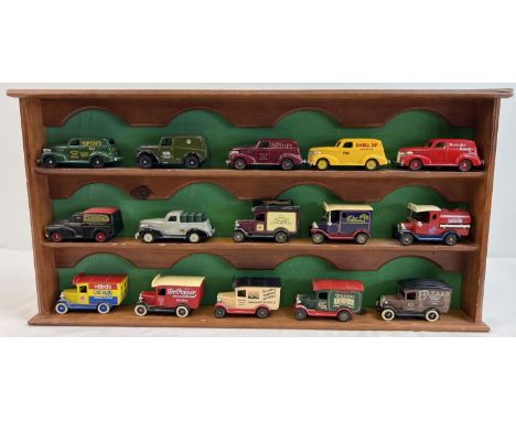 A wooden wall hanging display shelf unit for model cars, together with 15 advertising diecast vehicles by Lledo. To include S