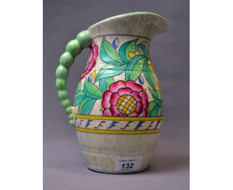 Crown Ducal, a painted and ribbed water pitcher with floral designs. Approximately 23 cm tall. 