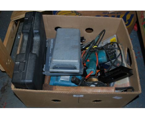 A box of assorted tools and power tools 