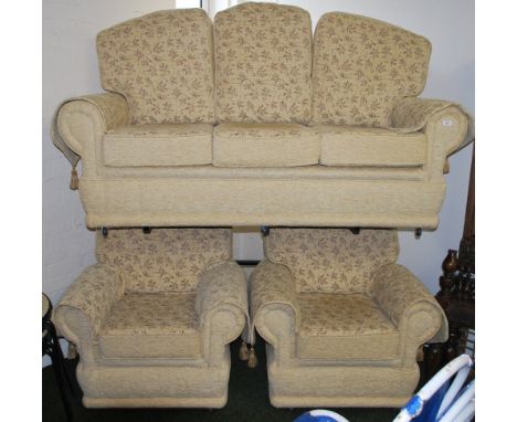 An upholstered three piece suite. Sofa approximately 182 cm high x 130 cm wide. 