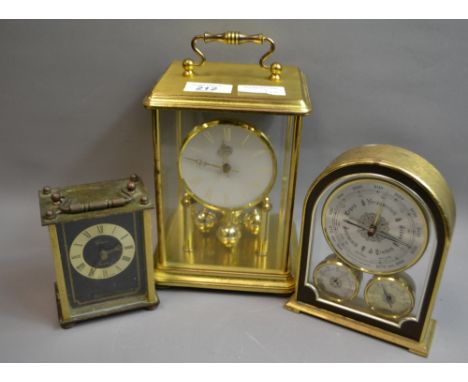 Two brass cased clocks, a desk barometer and an oak framed barometer. 