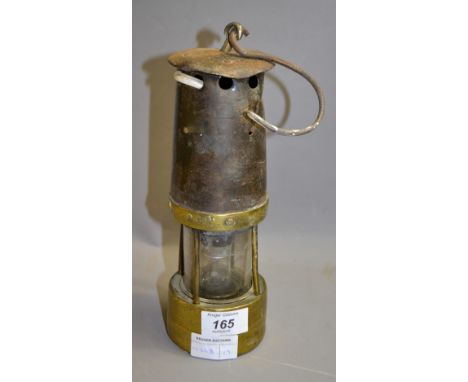 A miners lamp. Approximately 25 cm high. 
