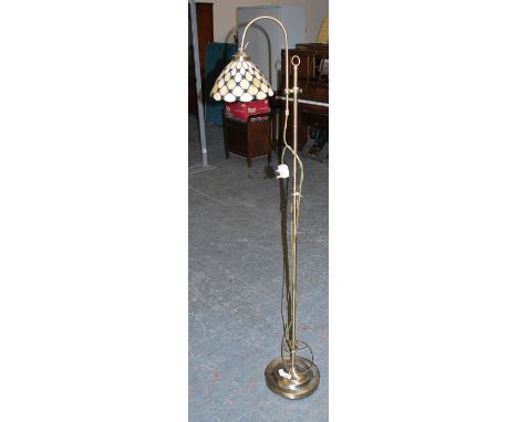 A reproduction modern standard lamp having stain glass shade