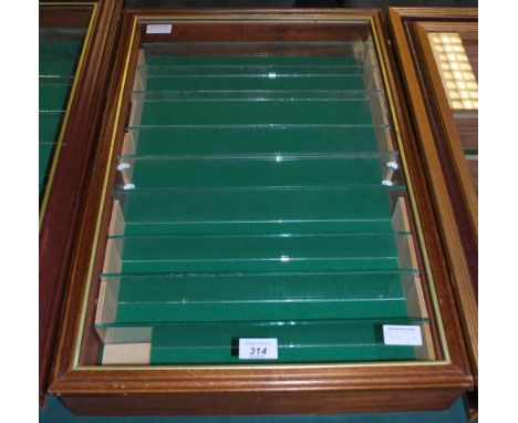 A wall hanging, nine shelf specimen cabinet.