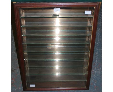 A nine shelf specimen cabinet in light wood.