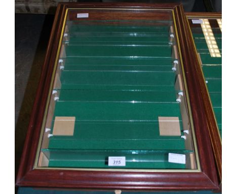 A wall hanging, nine shelf specimen cabinet.