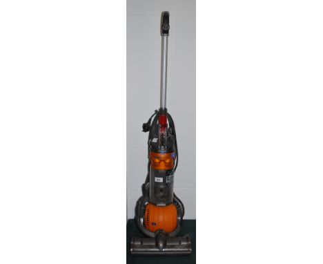 A Dyson roller-ball upright vacuum cleaner