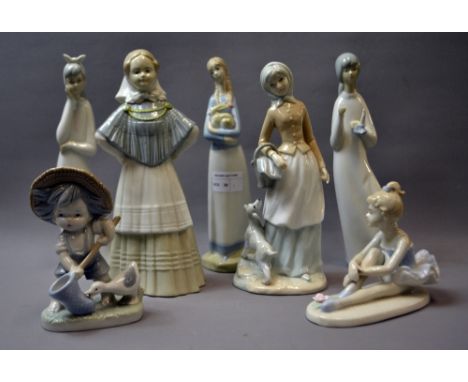 A selection of Lladro style ceramic figures. Tallest approximately 24 cm in height.