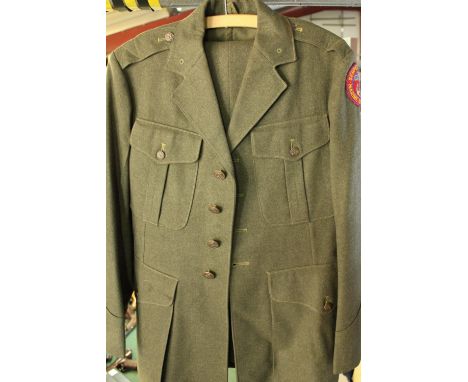 WWII period US Marine dress uniform of stitched wool jacket and trousers, later patch for Marine Corps league 