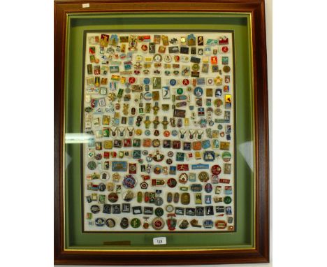 Selection of c1980 USSR enamel badges, mostly relating to Moscow Olympics.  Framed and glazed. 