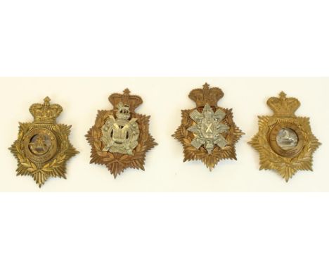 Four British military helmet badges, including Liverpool &amp; Durham Light Infantry (possible re-strikes), two similar Scott