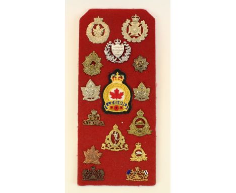 Mounted display of Canadian military cap badges including Saskatoon Light Infantry, R.C.A.P.C, Queen's Rangers, etc (15) 