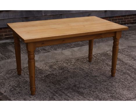 A light oak kitchen table, on turned supports, 57" x 33"