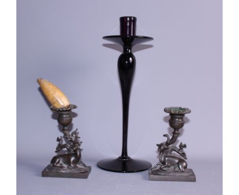 A pair of 18th Century bronze candlesticks, formed as deer, 4 1/2" high, and a glass candlestick, 12 1/2" high