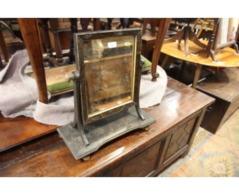 A 19th century swing frame toilet mirror with chinoiserie lacquered decoration, on plateau platform base, 18" wide