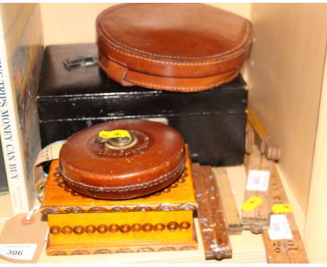 A leather jewel box, a poker workbox, a leather travelling shaving mirror, a number of folding rulers and a leather cased tap