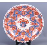 A Delftware charger of Imari design, 16" dia