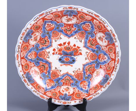 A Delftware charger of Imari design, 16" dia