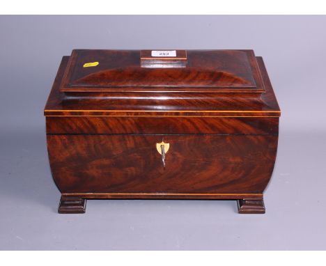 A 19th century figured mahogany and box line inlaid three-division tea caddy, on shaped supports, 14" wide