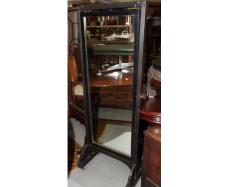 An ebonised swing frame cheval mirror, plate 17" x 47"