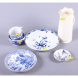 An 18th century Worcester saucer dish with blue and white floral decoration (extensive crack), a