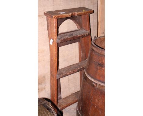 A pair of four-tread wooden step ladders