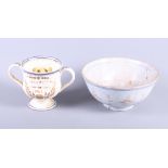 An 18th century Delftware bowl with orange decoration, 9" dia (damages) and a 19th century frog