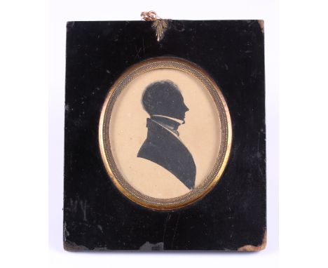A mid 19th century portrait silhouette of an unknown man, 3" x 2 1/2", in ebonised frame, a 19th century portrait silhouette 