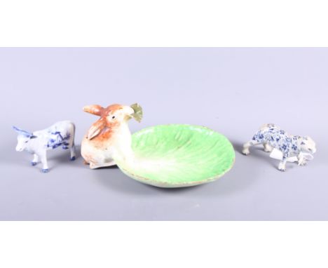 An 18th century Continental model of a tiger, 4 1/4" long (leg restored), a ceramic dish with a rabbit, 8 1/2" wide, and a De