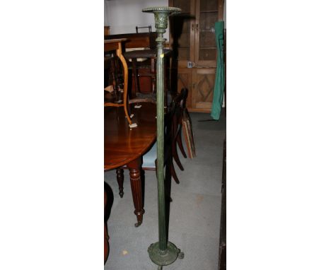 A brass Corinthian column standard lamp, on square stepped base with paw feet, and a gilt metal uplighter with glass shade