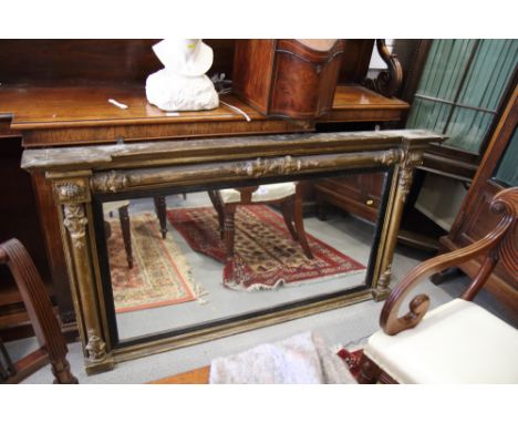 An early 19th century gilt framed over mantel mirror with flanking columns, plate 45" x 22"