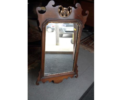 An early Georgian design carved walnut framed wall mirror, plate 13" x 24"