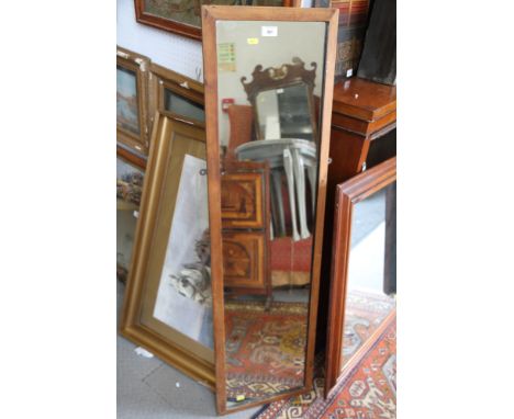 A slip mirror, plate 15" x 47", in strip frame