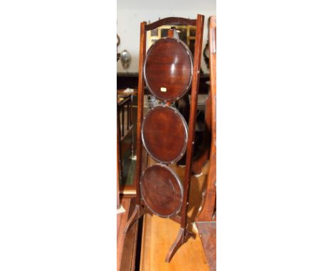 A mahogany three-tier folding cake stand and a mahogany wall shelf, 34" wide