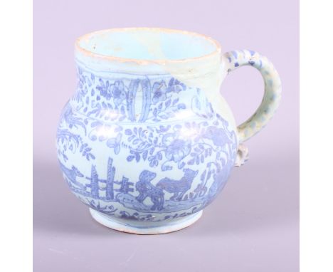 An early 18th century blue Delftware mug with museum quality restorations, landscape and animal decoration, 4" high