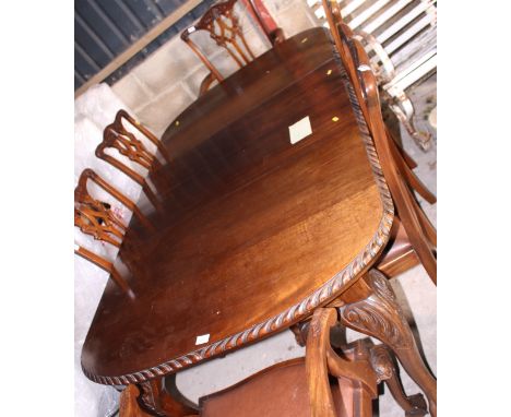 An early 20th century mahogany extending dining table of Chippendale design, on cabriole claw and ball supports, 70" x 42" wh