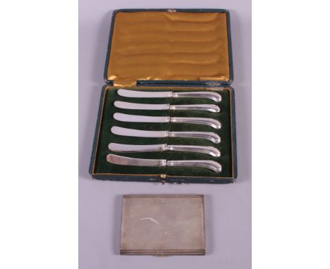 A silver cigarette case with engine turned decoration, 5.4oz troy approx, and a cased set of six silver handled tea knives