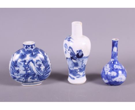 A 19th century Chinese blue and white porcelain snuff bottle with landscape decoration and two similar miniature vases