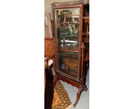 A carved walnut cheval mirror, plate 17" x 43"