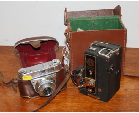 A Midas combined camera projector, in leather case complete with instructions, and a Kodak camera