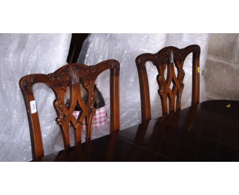 A set of six Chippendale design mahogany dining chairs with pierced backs and drop-in seats, on cabriole claw and ball suppor