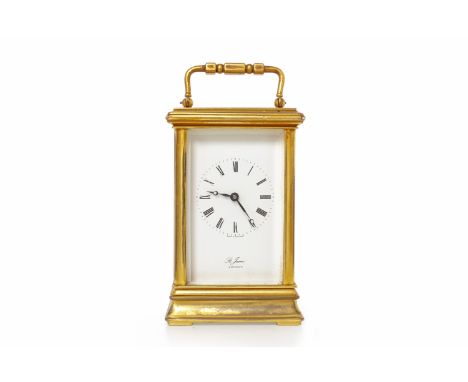 20TH CENTURY CARRIAGE CLOCK BY ST. JAMES OF LONDONthe white enamel dial with Roman numerals, brass and bevelled five glass go